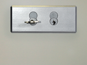 Authorized user key is retained (held/trapped) until the high level key is returned to its secure position.